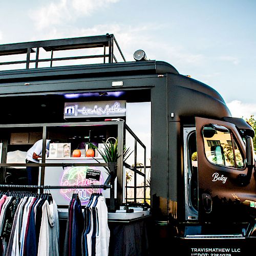 The image shows a fashion truck named 